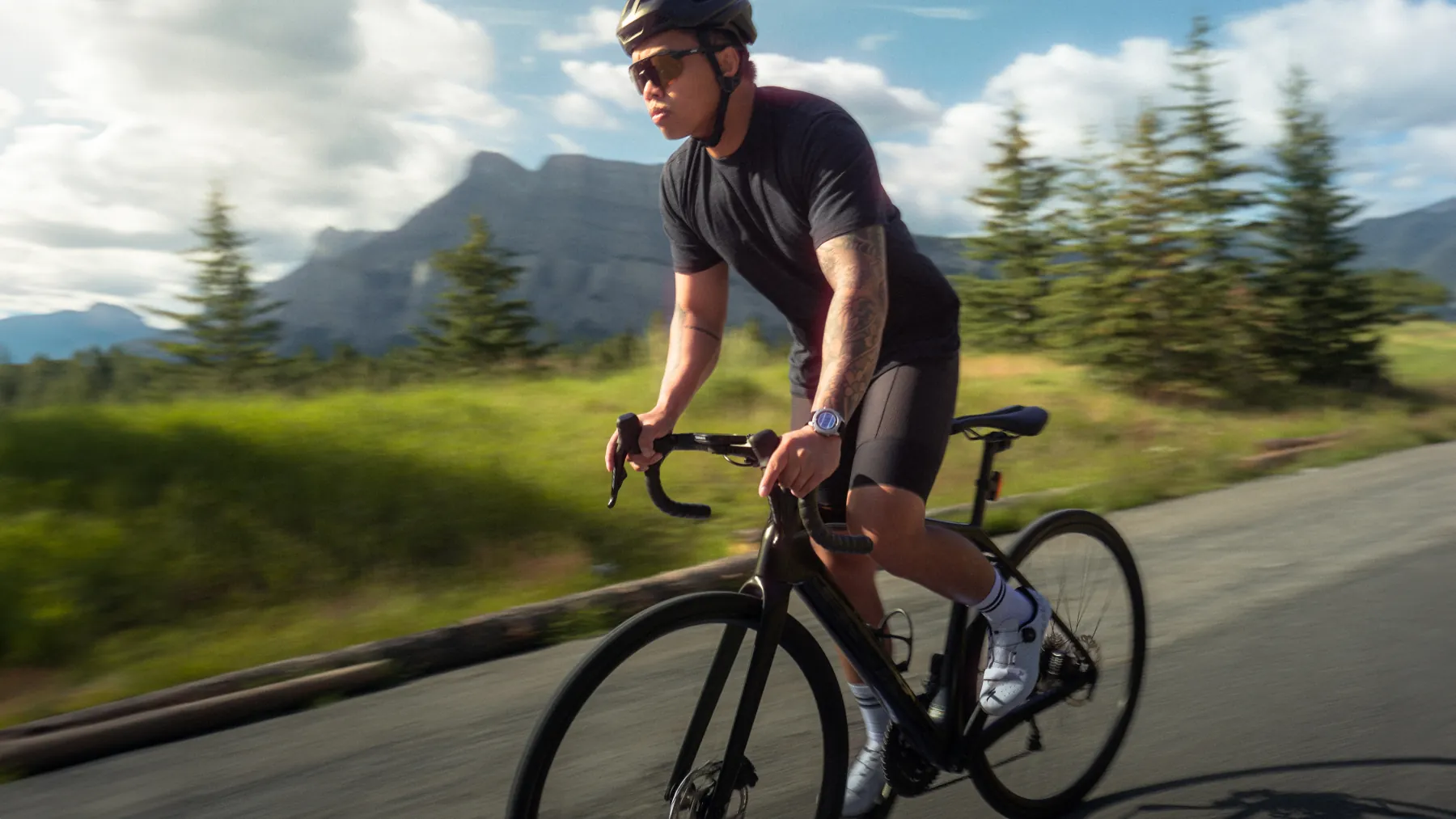 Cyclist in Spek athletic glasses riding a mountain road at pace