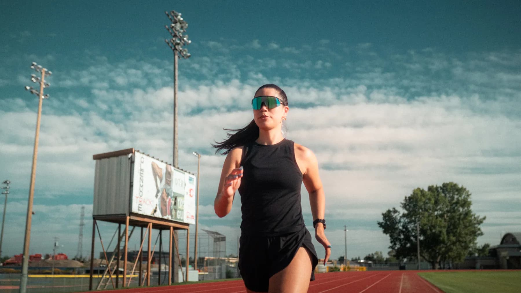 Runner head-on down the straight in mirrored Spek lenses